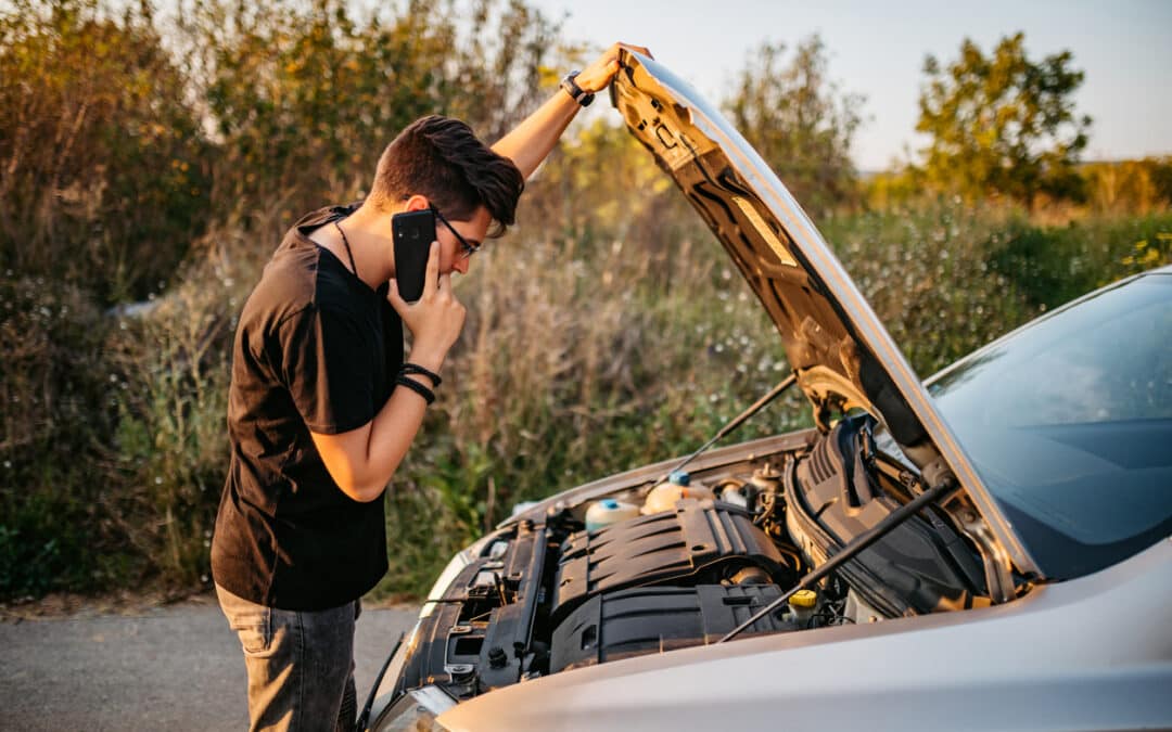 YoungCaucasian man had a car breakdown and calling roadside assistance.